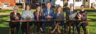 President Herbert and U N E faculty on the Portland Campus